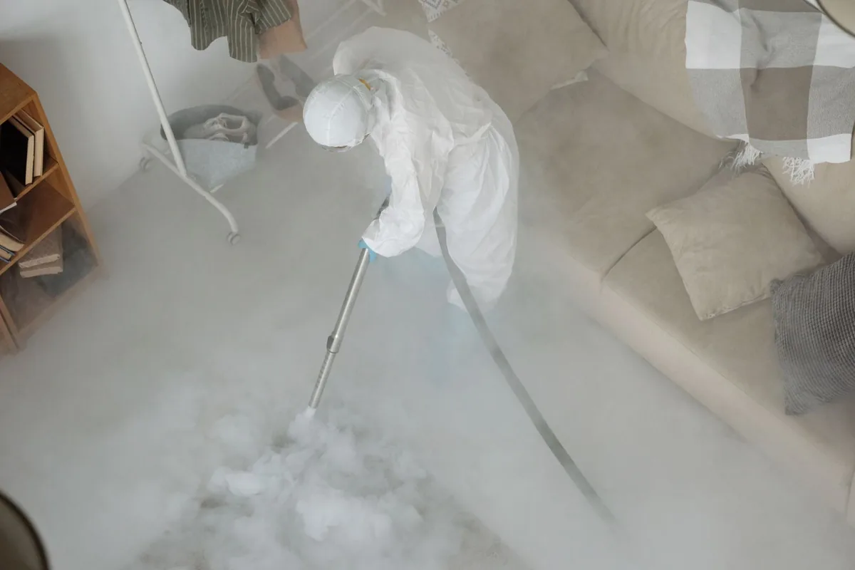 Biohazard cleanup technician in protective equipment, Guttenberg, NJ